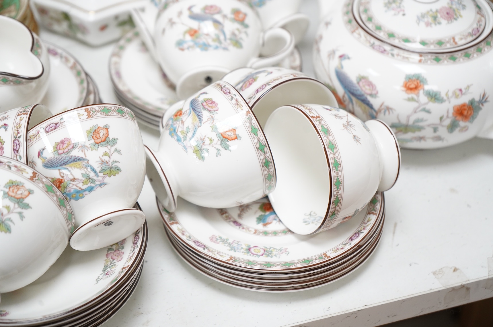 A Wedgwood Kutani crane part tea service, a collection of Cauldon tea wares and two pieces of Crown Derby Imari, largest 27cm in diameter